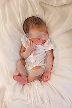 African newborn baby in white romper