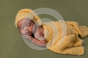 African newborn baby with yellow hat