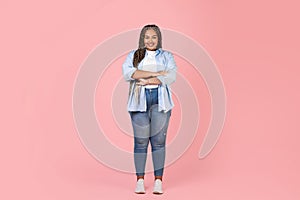 African Obese Woman Standing Crossing Hands Smiling On Pink Background