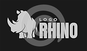 African rhino silhouette. Logo, symbol on a dark background. Vector illustration.