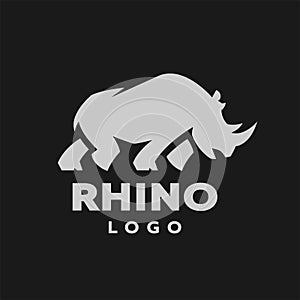 African rhino silhouette. Logo, symbol on a dark background. Vector illustration.