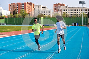 African runners training in an outdoors athletics track