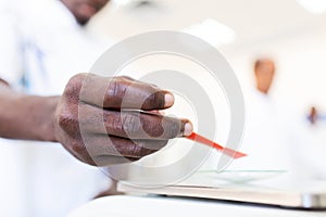 African scientist hand testing in the laboratory