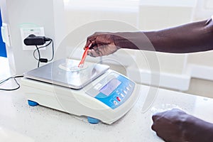 African scientist testing salt in the laboratory