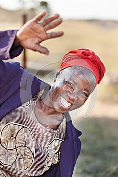 African senior citizen woman greeting