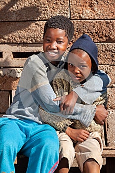 African siblings in a village