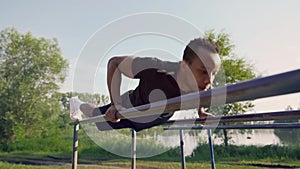 African strong man doing push ups exercises on sport field