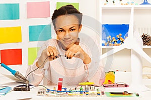 African student completing an electrical circuit