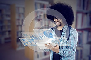 African student with futuristic screen in the library