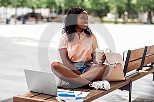 african student girl with coffee, laptop and books