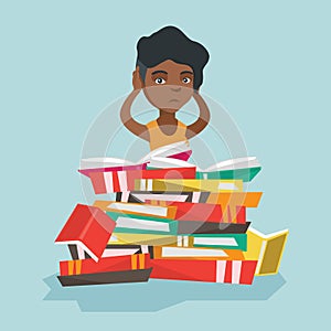 African student sitting in a huge pile of books.