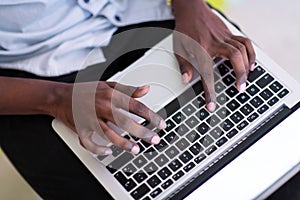 African student using laptop computer