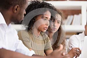 African teacher team leader speaking explaining online work to employees