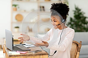 African Teen Girl At Laptop Learning Having Class Sitting Indoors