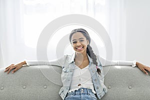 African Teen Girl Sit On Couch At Home