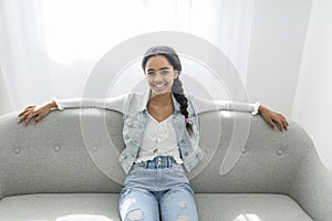 African Teen Girl Sit On Couch At Home