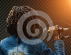 African Teenager Woman Afro hair sing a song