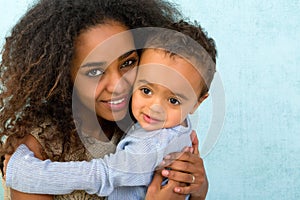 African toddler hugging mom