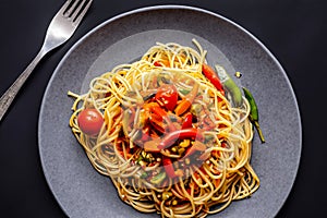 African traditional Spaghetti pasta with spicy sauce and vegetable