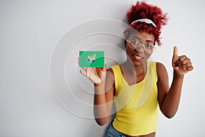 African woman with afro hair hold Federal Capital Territory flag isolated on white background, show thumb up. States of Nigeria