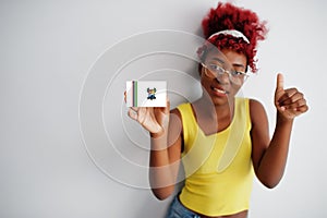 African woman with afro hair hold Lagos flag isolated on white background, show thumb up. States of Nigeria concept