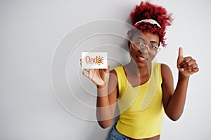 African woman with afro hair hold Ondo flag isolated on white background, show thumb up. States of Nigeria concept photo