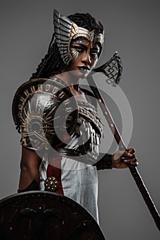 African woman amazon with shield and axe dressed in armor