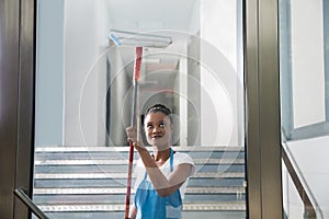 African Woman Cleaning Glass