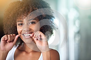 African woman, dental floss and smile in portrait for oral wellness, health and benefits for mouth in morning. Girl