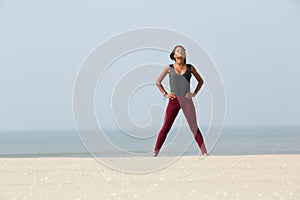 African woman doing yoga breathing exercise