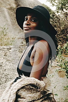 African woman, fashion and closeup with nature, portrait and beach for adventure. Tourist, clothes and holiday for