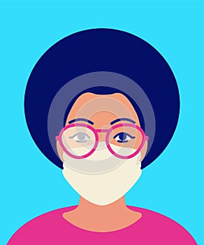African woman in foggy glasses and in protective facial mask. Concept of condensation problem on glass when wearing mask in cold