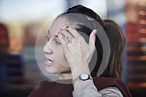 African woman gesturing with the hand on the face