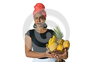 African woman holding a basket of fruits on an  white background for cut out