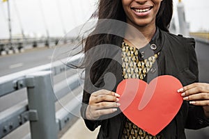 African Woman Holding Heart Shape Symbol Love Concept