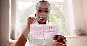 African Woman Kissing Gamble Ticket