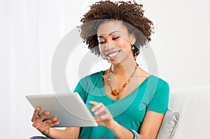 African Woman Looking At Digital Tablet