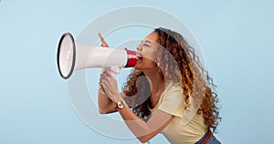 African woman, megaphone and protest, voice or power and broadcast or announcement on a blue background. Young person