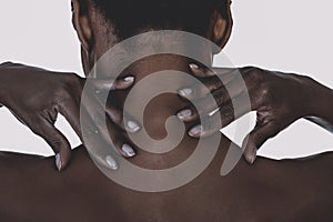 African woman with neck ache