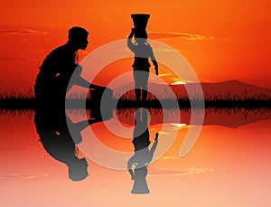 African woman plucks water at the river