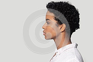 African woman profile side closeup face isolated on grey background