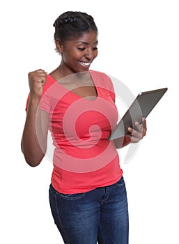 African woman in red shirt winning internet auction