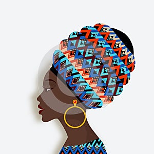 African woman in scarf and earrings in profile