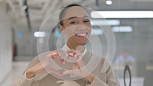 African Woman showing Heart Shape by Hands