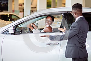 African woman surprised by new car, gift for my beautiful wife