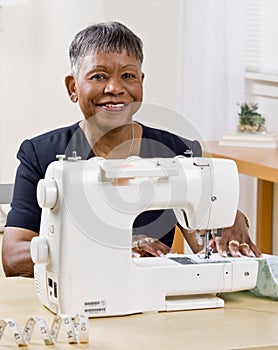 African woman using sewing machine