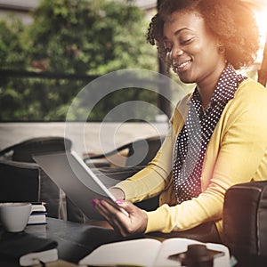 African Woman Using Tablet Relaxation Concept