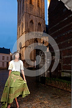 African woman in Victorian dress old city