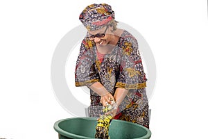 African woman washing clothes at home