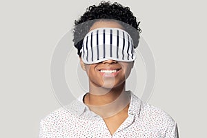 African woman wearing eyes sleep mask for comfortable daytime nap